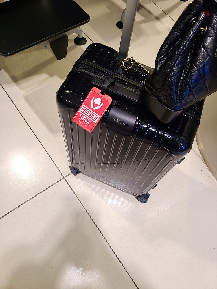 Does a fragile sticker really protect your bags? Ask a baggage handler - NZ  Herald